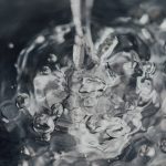 water droplets on body of water